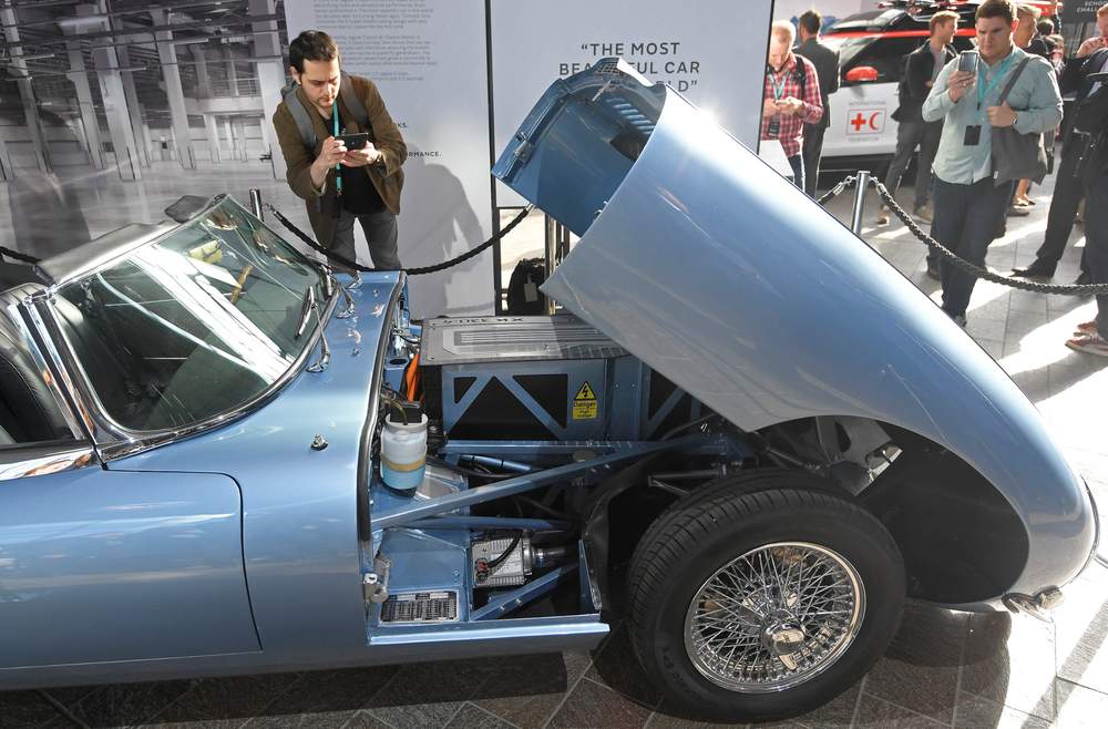 A visitor views a classic Jaguar E-Type modified with an electric engine on display at the Jaguar Land Rover 'Tech Fest' in London, in September. 
Photo: Reuters