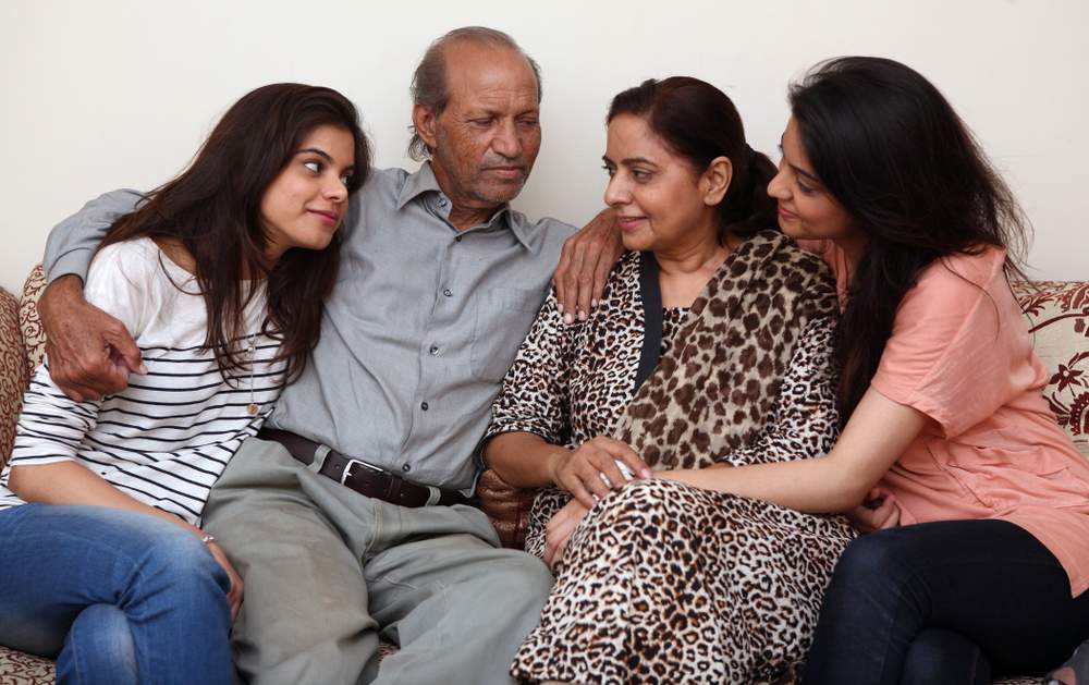 Captain Jawaid Khan with his wife Shahnaz Jawaid two daughter in their Karachi home the day after he was released in August 2012. Asim Hafeez for The National