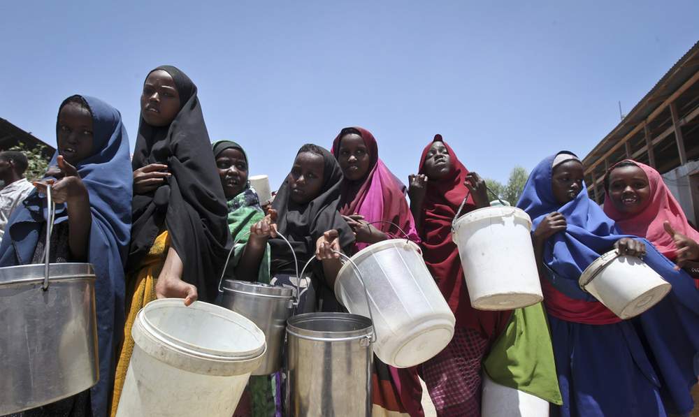 Somali girls who fled drought in southern Somalia stand in a queue to receive food handouts in Mogadishu. Farah Abdi Warsameh \/ AP 